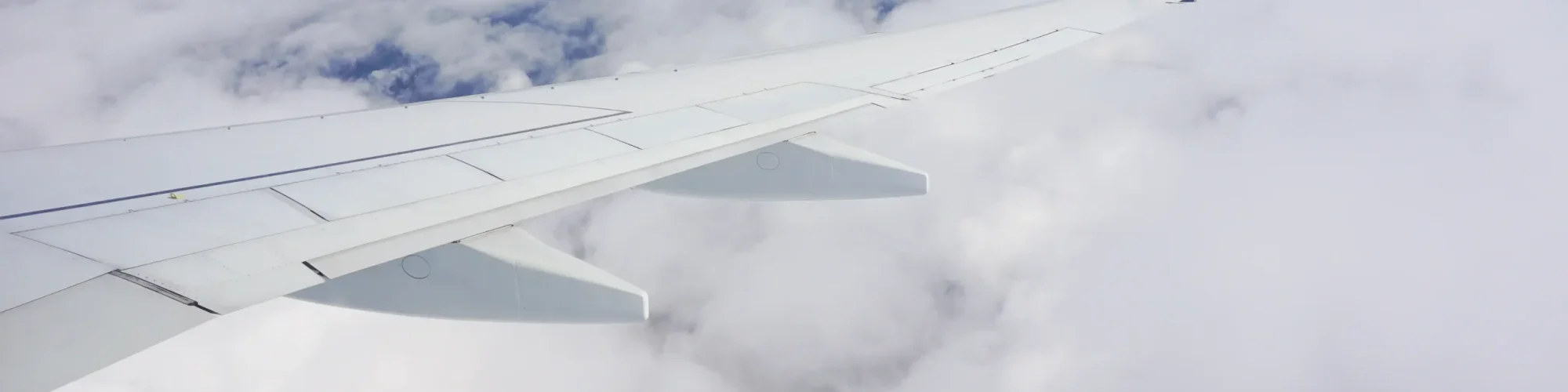 beautiful-shot-sky-full-clouds-airplane-wing-from-plane-window